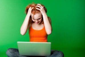 Frustrated woman at computer
