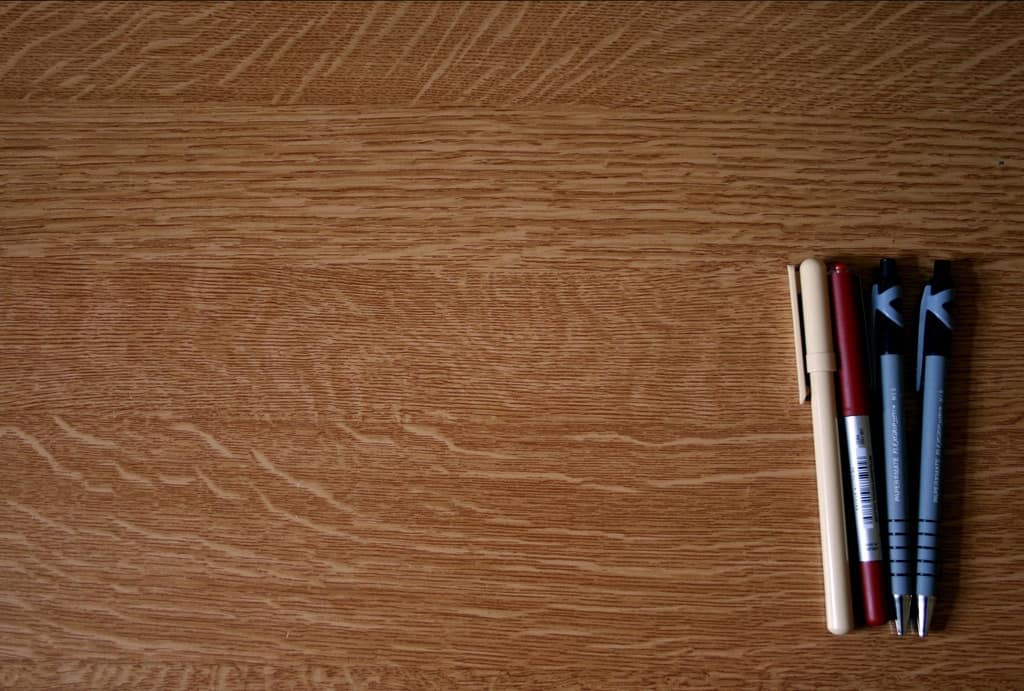 Image of pens on a table, Revision Time by flickr user Louis Beche