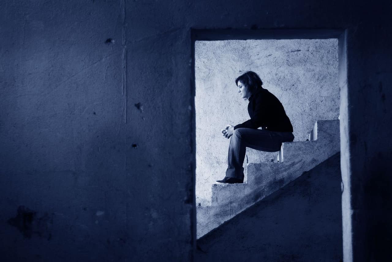 Lonely Woman sitting on Steps