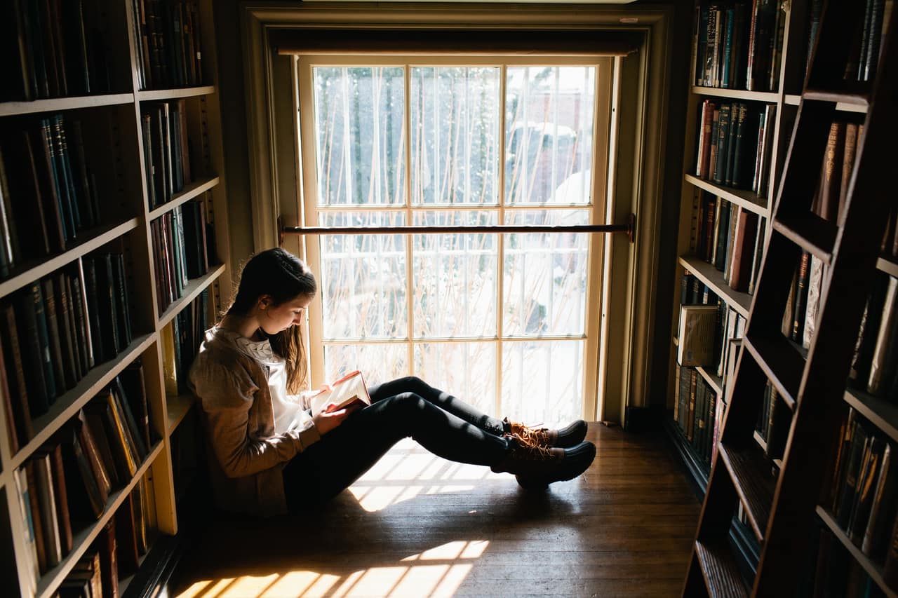 Young Woman Reading Book