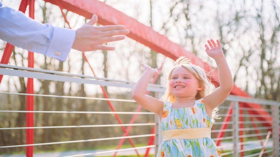 Image of a girl giving a man a high-five