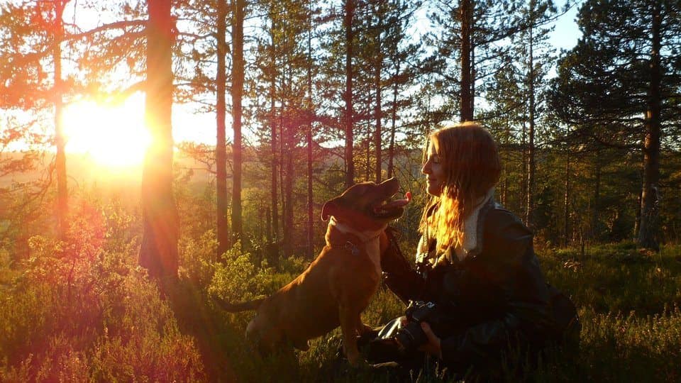 image of a girl sitting with her dog