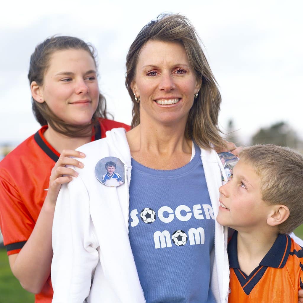 Soccer Mom with Kids --- Image by © Royalty-Free/Corbis
