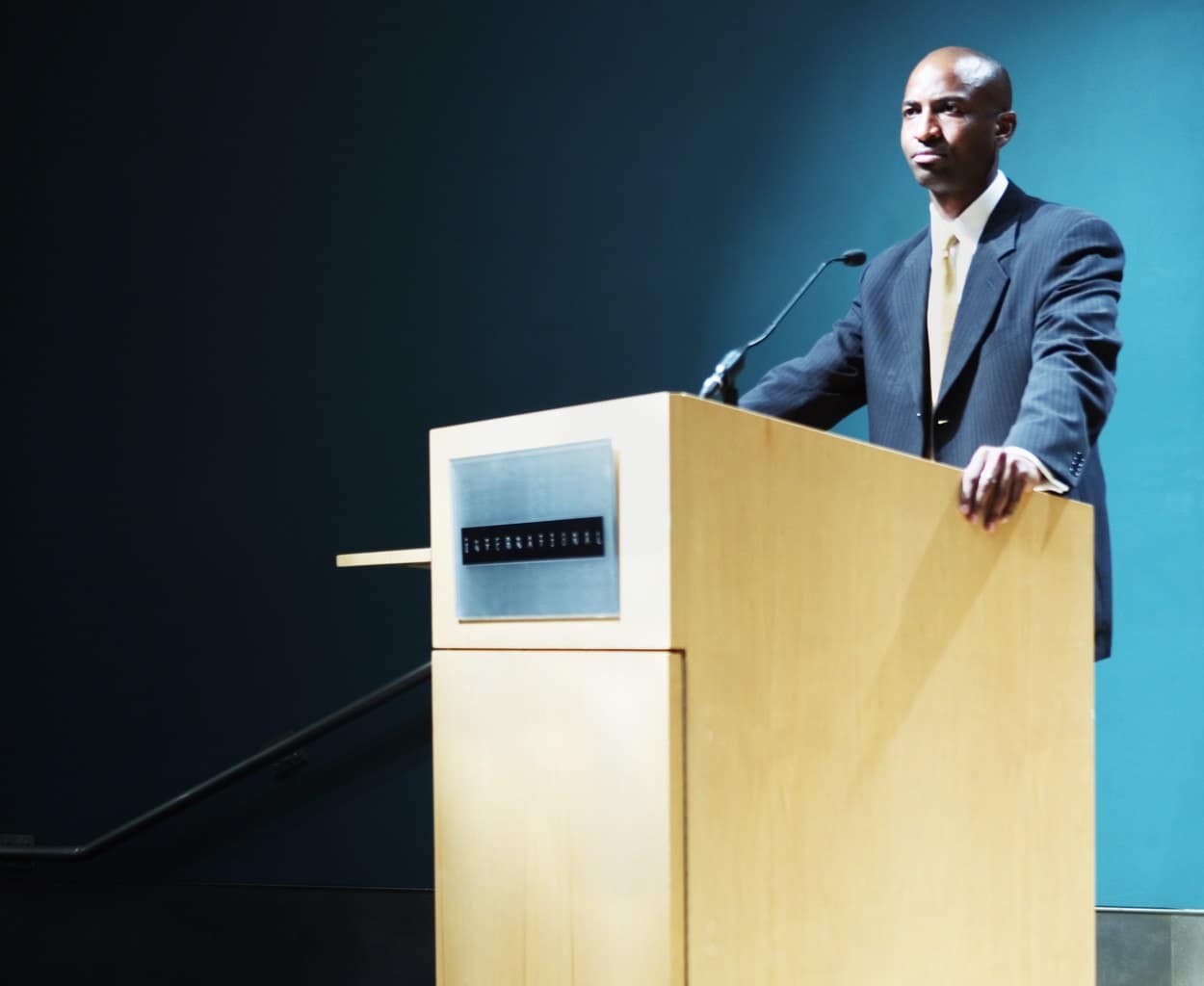 Speaker at Podium --- Image by © Royalty-Free/Corbis
