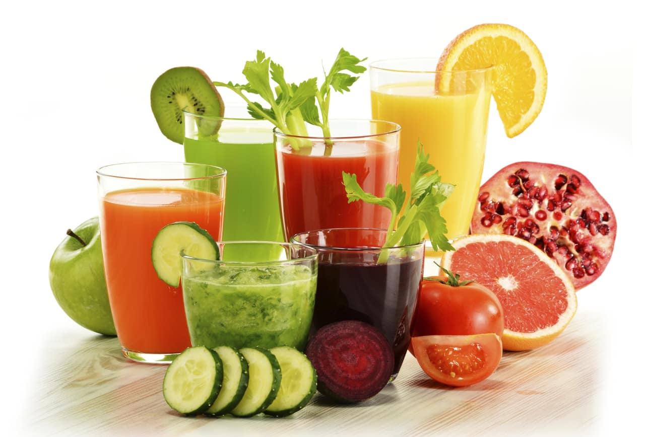 Glasses with fresh organic vegetable and fruit juices isolated on white. Detox diet.