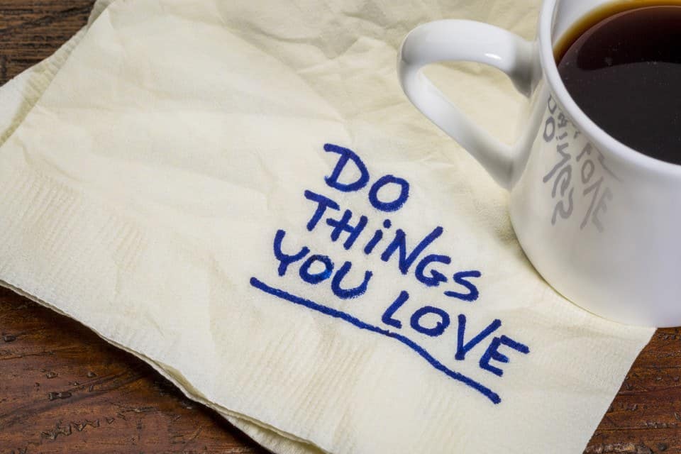 do things you love - motivational handwriting on a napkin with a cup of espresso coffee