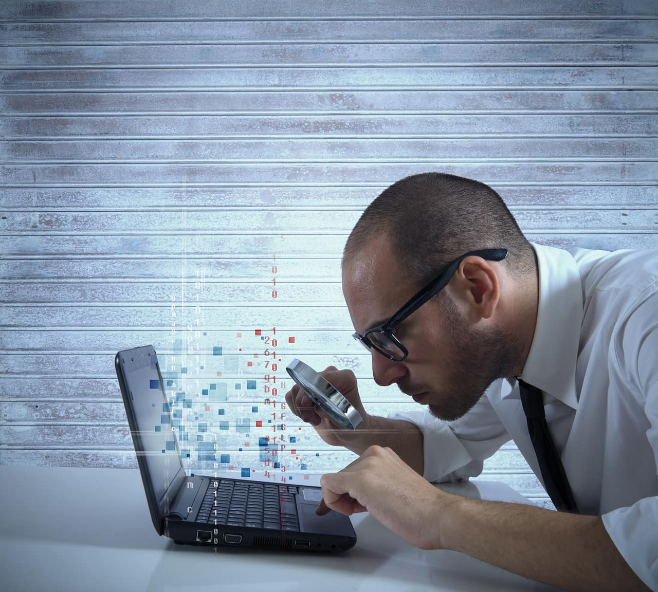 Businessman looking for virus and hacking in a laptop