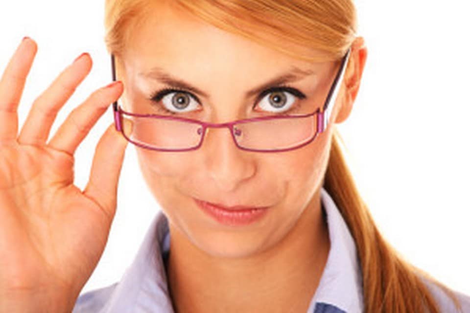 A picture of a young beautiful woman looking at something over white background