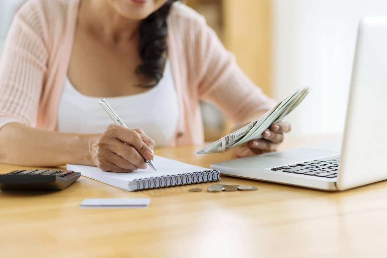 Woman distributing family budget