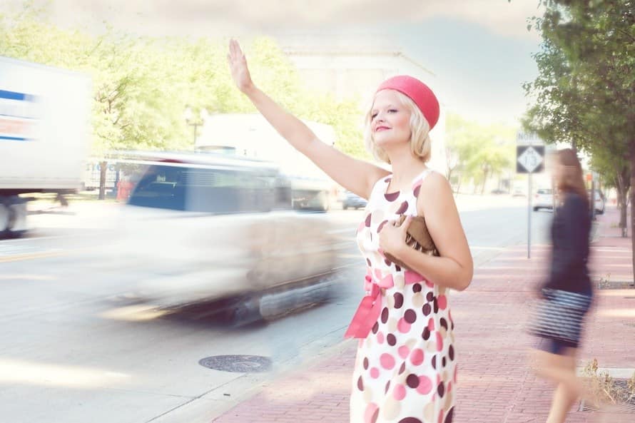 woman-blonde-styled-hair-hailing-cab