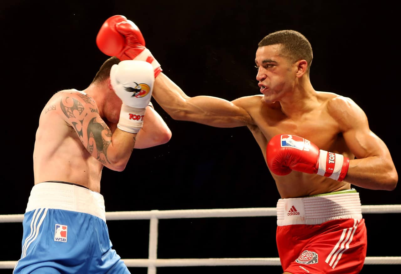 LONDON, ENGLAND - DECEMBER 14:  Sam Maxwell of British Lionhearts (R) in action with David Oliver Joyce of German Eagles during their 57-61kg bout in the World Series of Boxing between British Lionhearts and German Eagles at Earls Court on December 14, 2012 in London, England.  (Photo by Scott Heavey/Getty Images) *** Local Caption *** Sam Maxwell; David Oliver Joyce