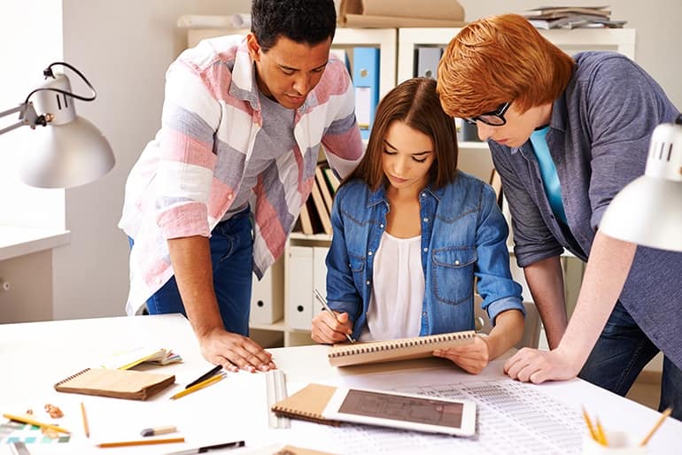 Group of students making construction sketch in college