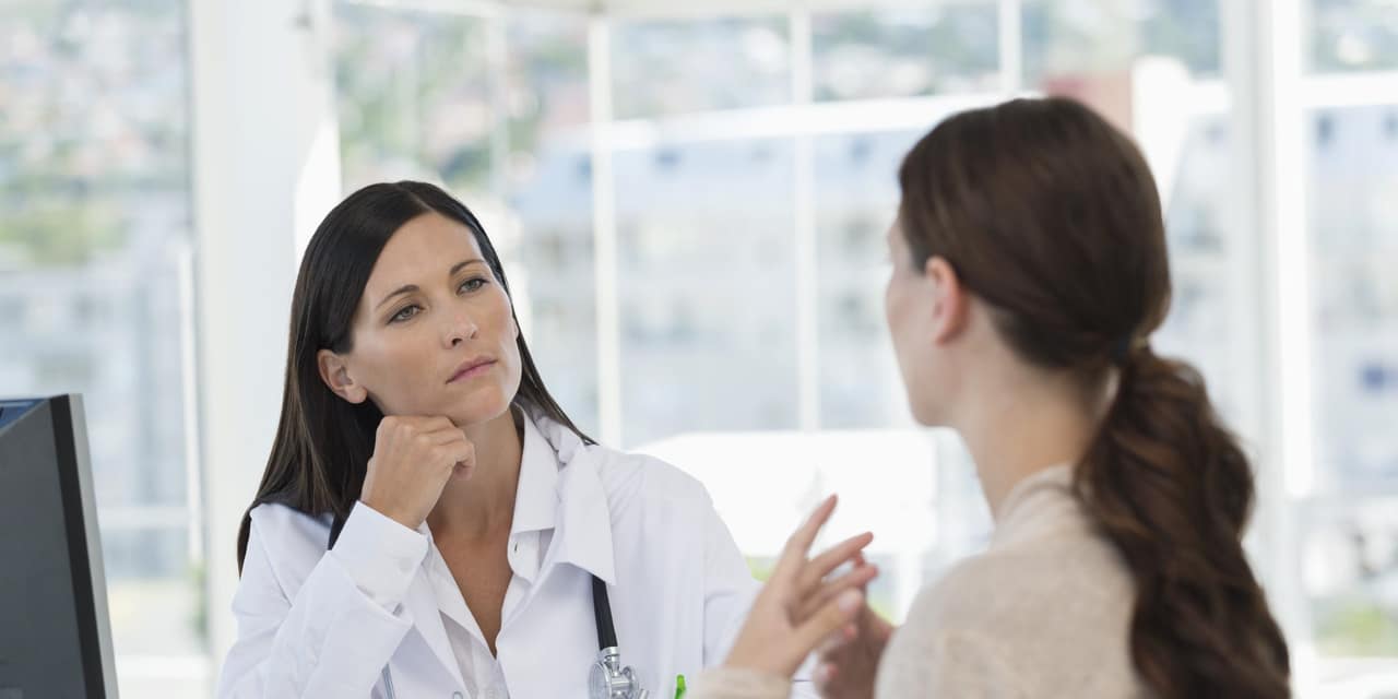 Female doctor discussing with a patient