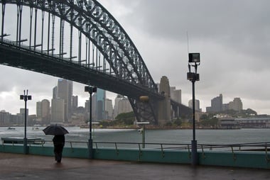 Solitary figure in the rain: Outside Luna Park, Sydney