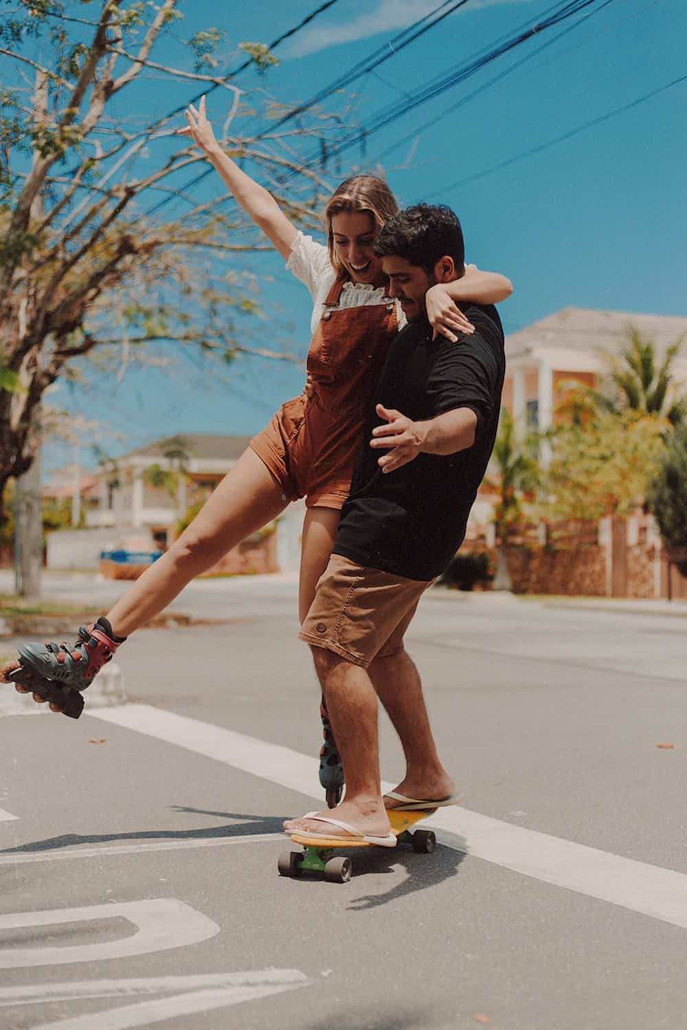 couple roller skating on the street