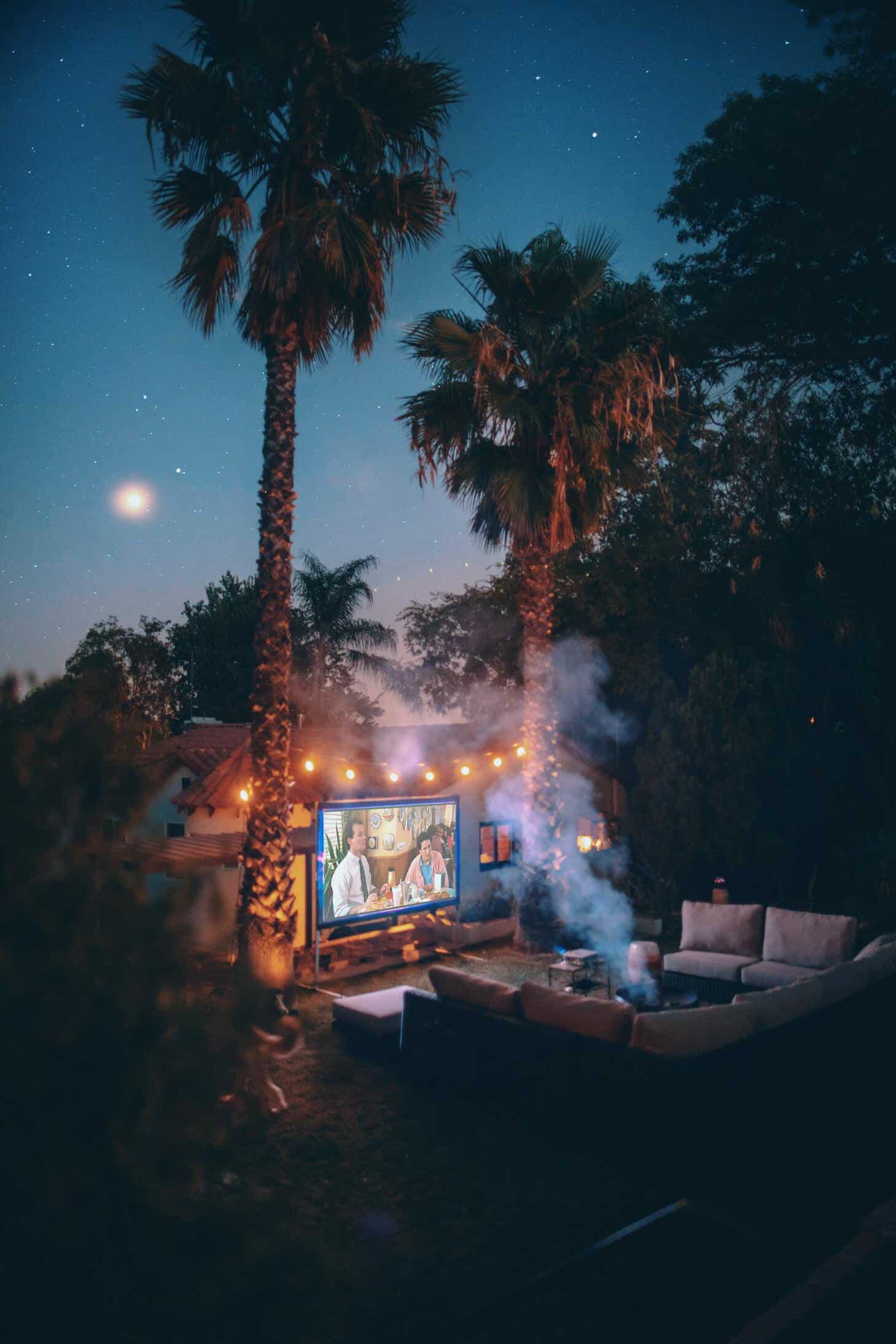 movie projected outdoors with couch
