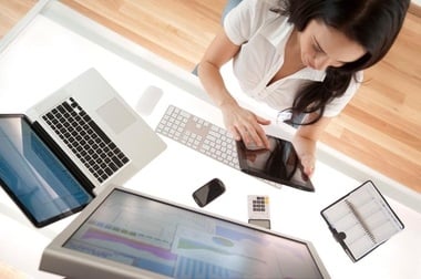 Businesswoman at her desk using a digital tablet