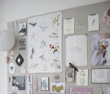 drawings and paper on home office wall
