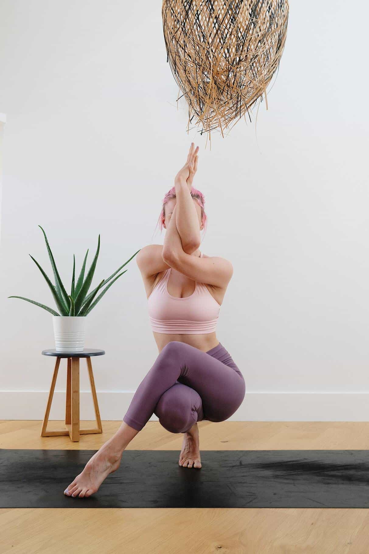 woman exercising on yoga mat