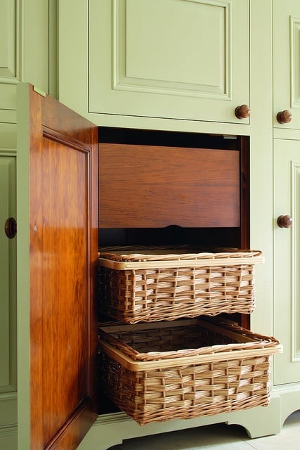 Basket drawers in a light green cupboard