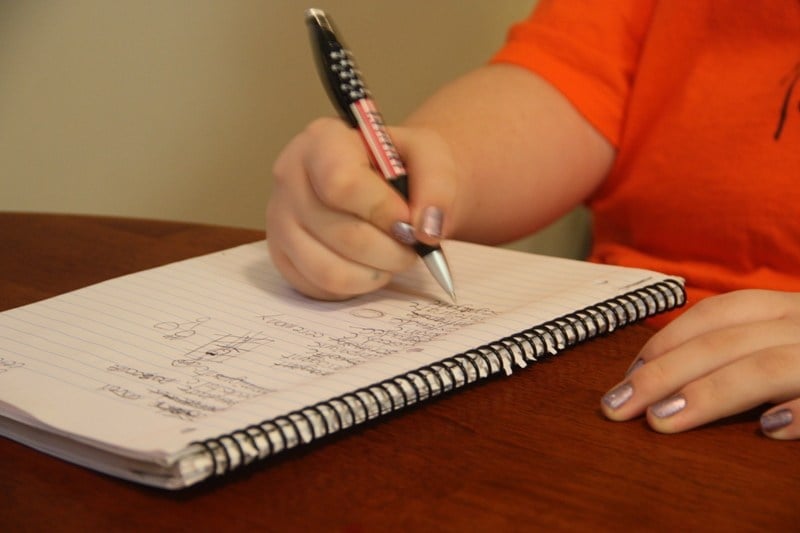 Girl writting in notebook