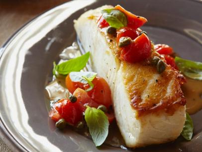 Halibut with Pepitas, Capers, Cherry Tomatoes, and Basil
