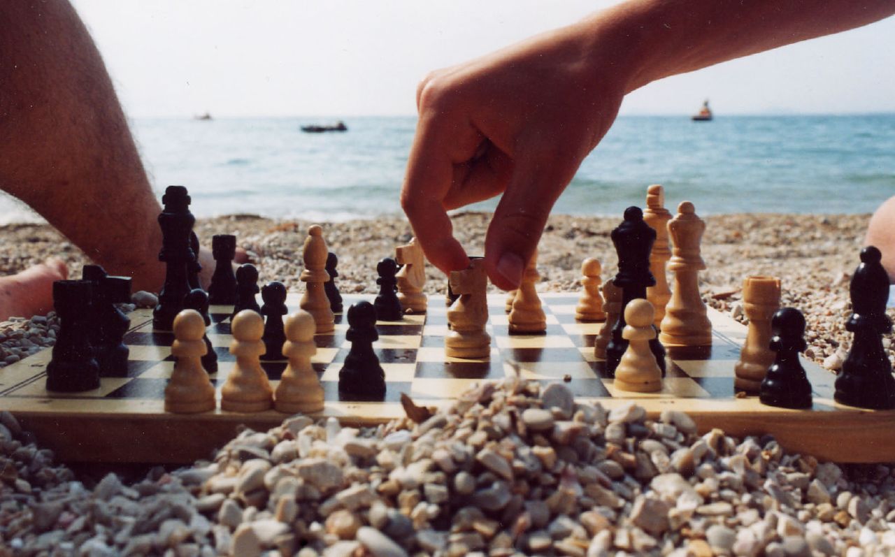 playing chess on the beach