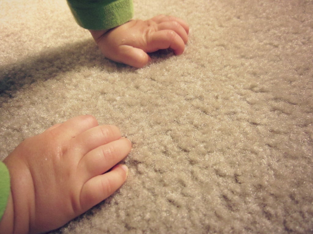 Baby hands on the carpet