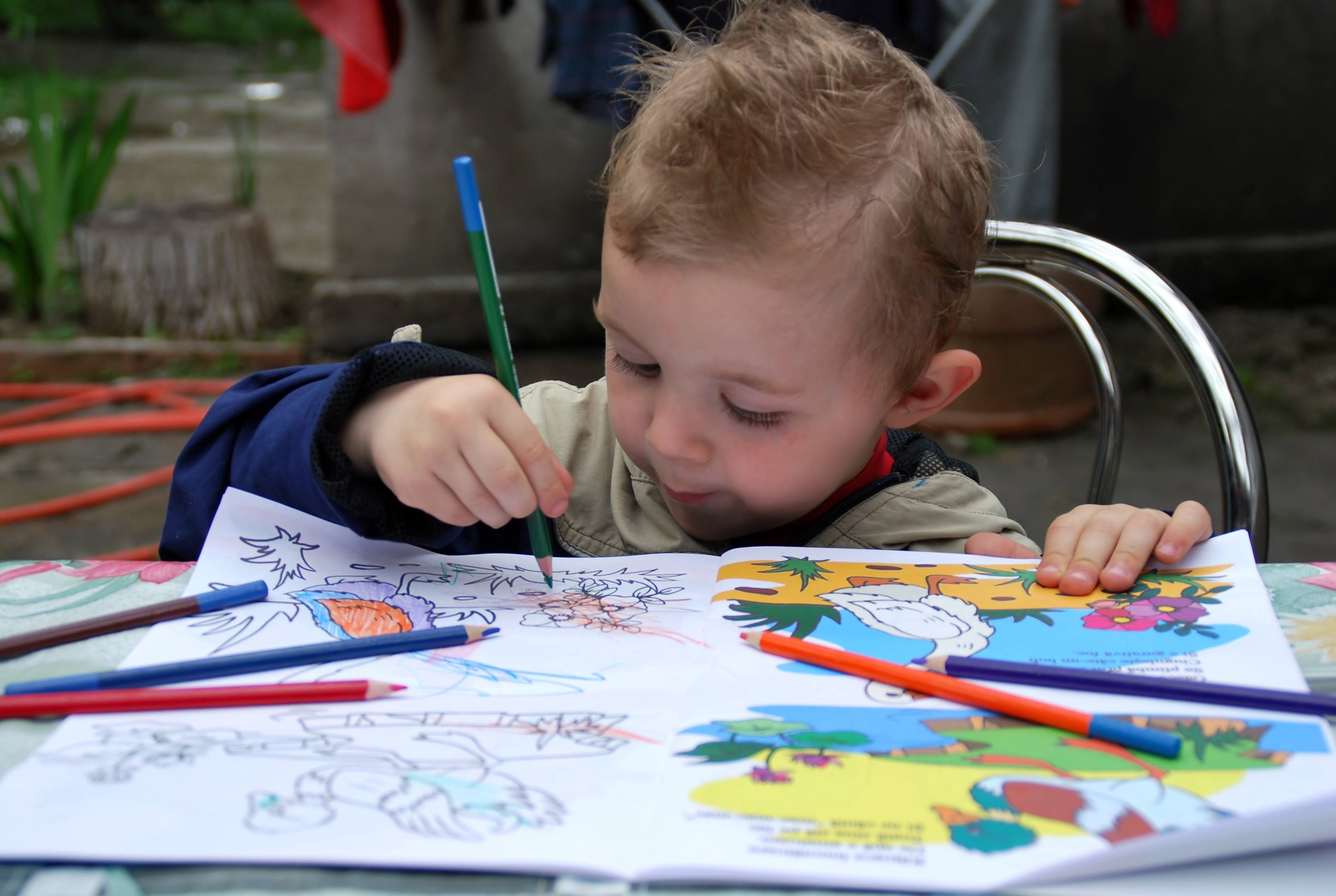 Toddler with a coloring book