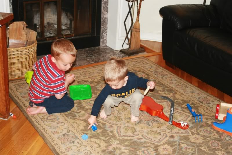 Toddlers cleaning up