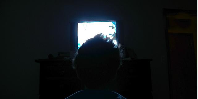 Child Watching TV in the Dark