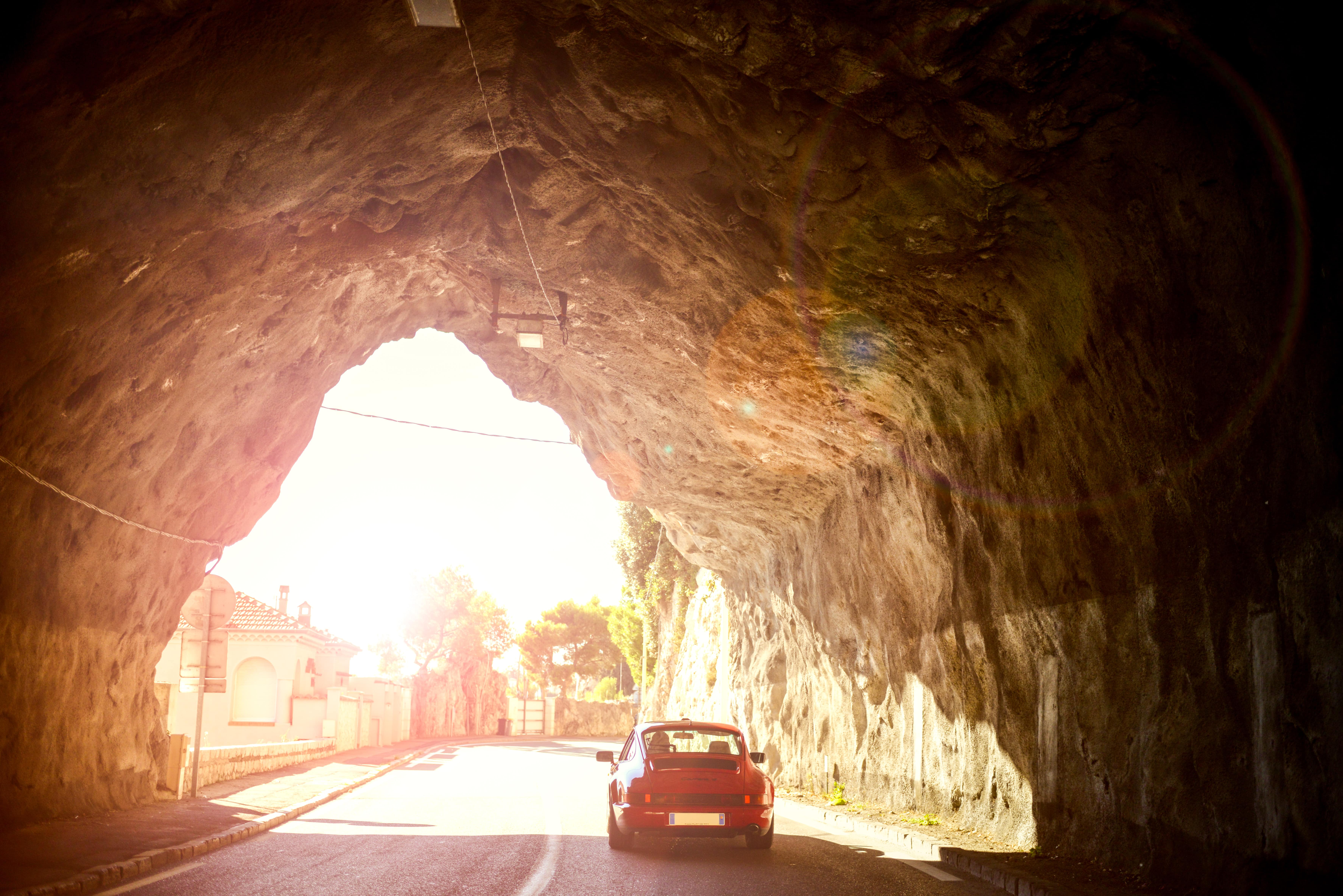 Vinatge Porsche Car Driving Through Tunnel-min
