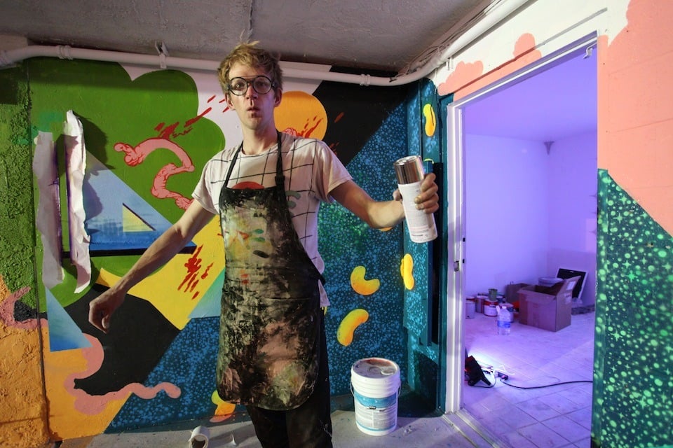 Artist Benji Geary stops to be photographed while stenciling in a recent exhibition at the Life is Beautiful festival in Las Vegas.