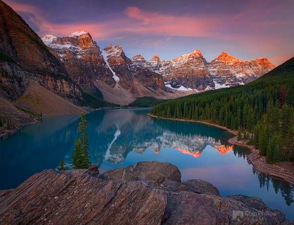 Sunrise over Moraine Lake in Banff National Park, seen from the top of the rock pile.