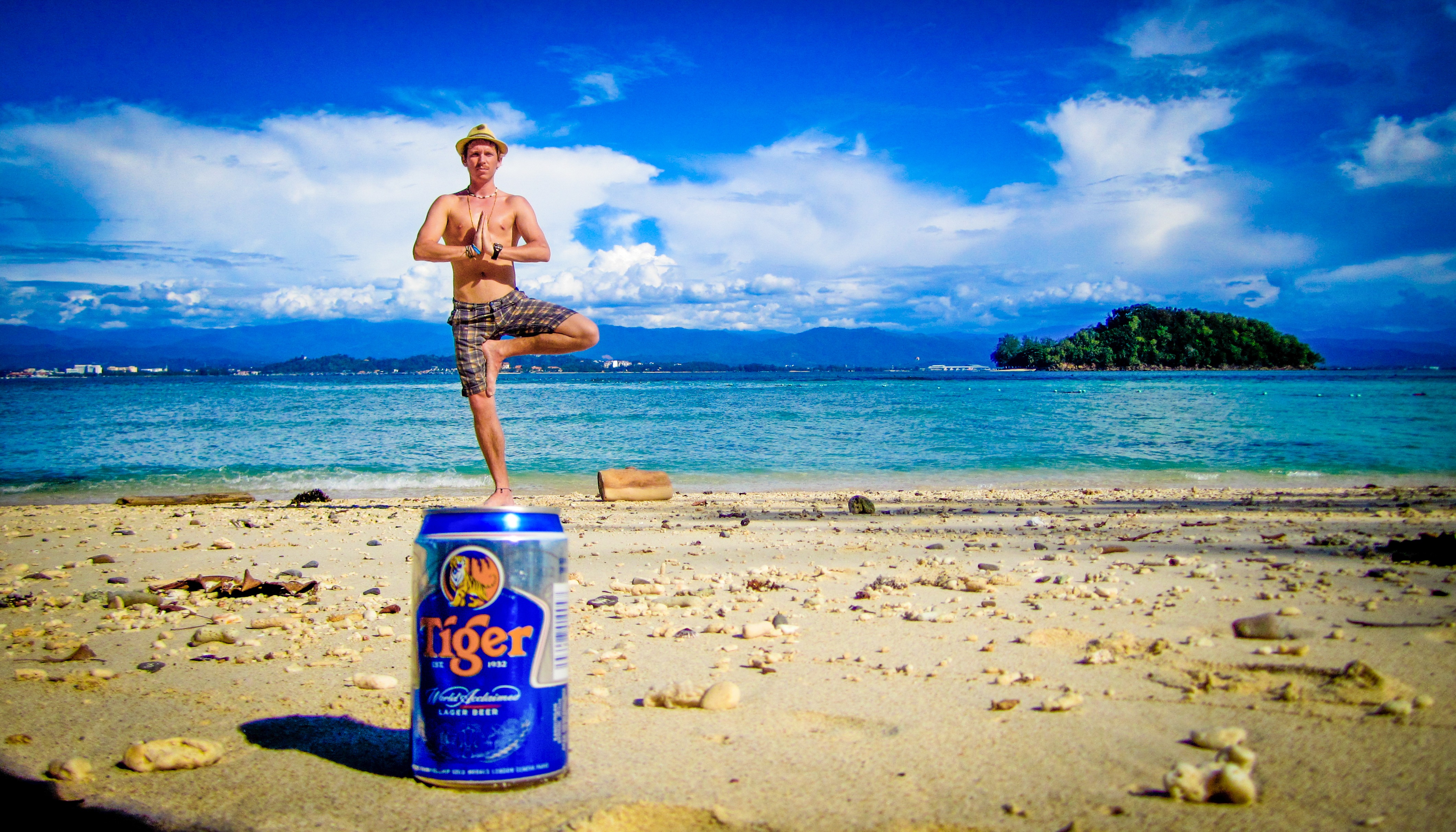 Man Using Perspective To Stand On Top Of Beer Can