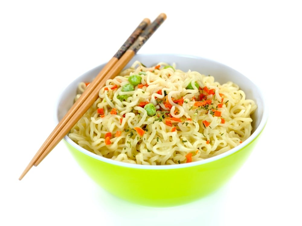 Cooked instant noodles isolated against a white background
