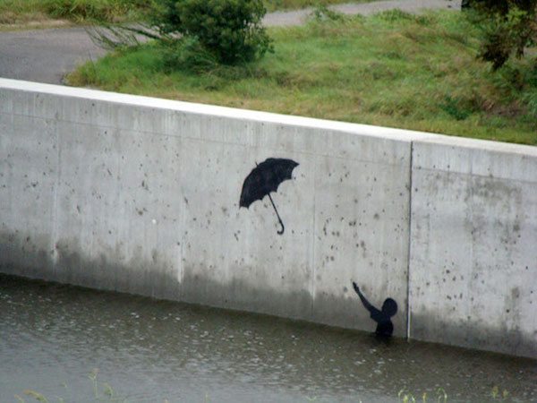 banksy-graffiti-street-art-boy-umbrella