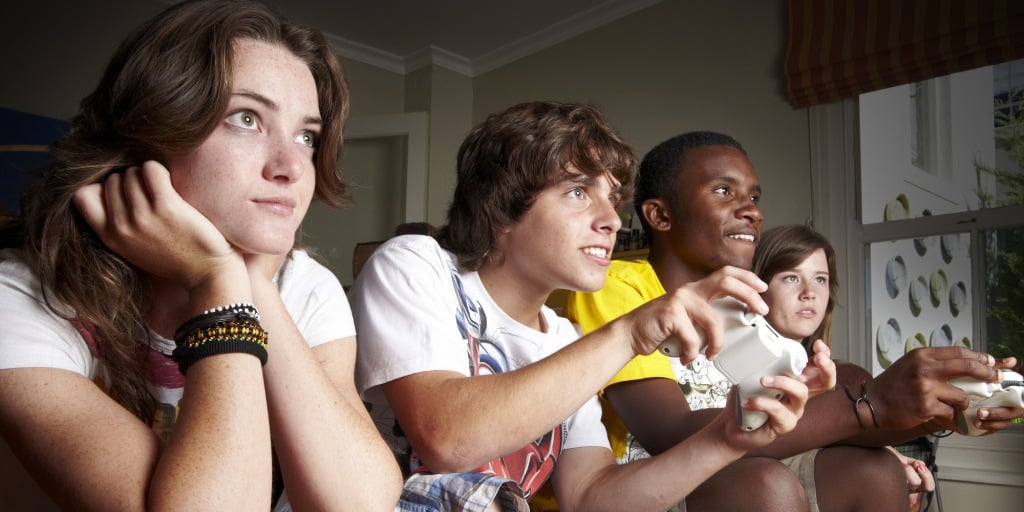 Teen friends playing TV games