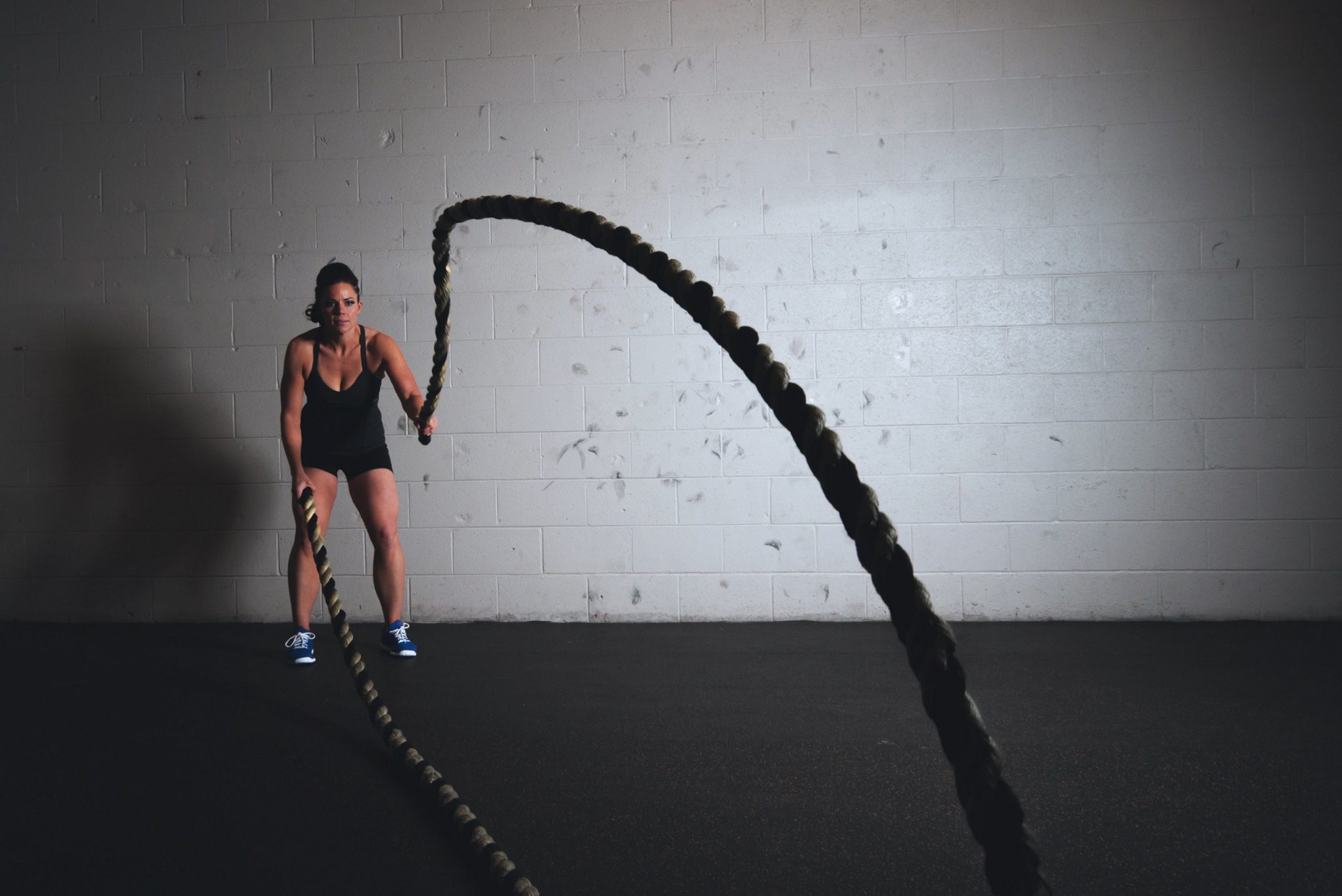 Girl with battle ropes