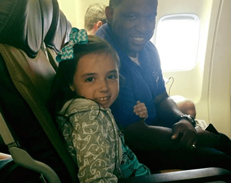 This Flight Attendant Sits Beside A Little Girl During A Flight, At The End All Passengers Clap For Them