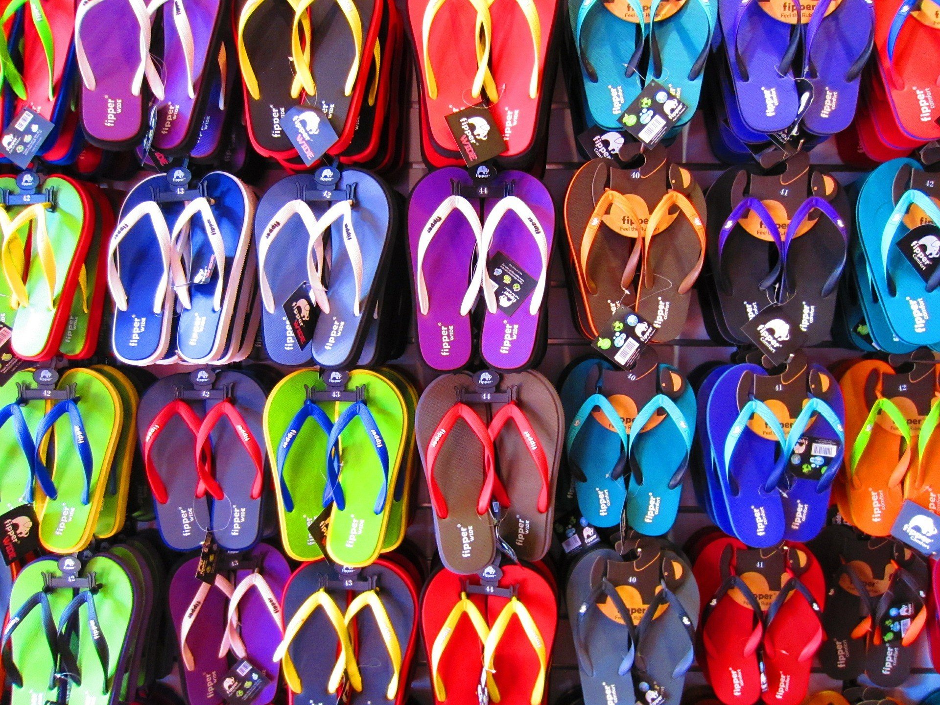 Picture of a wall of flip-flops.