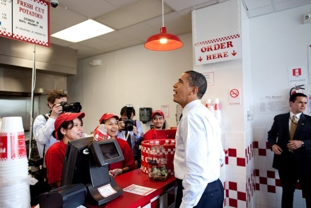 President Obama orders lunch at Five Guys in Washington, D.C. during an unannounced lunch outing May 29, 2009. (Official White House Photo by Pete Souza) This official White House photograph is being made available for publication by news organizations and/or for personal use printing by the subject(s) of the photograph. The photograph may not be manipulated in any way or used in materials, advertisements, products, or promotions that in any way suggest approval or endorsement of the President, the First Family, or the White House.
