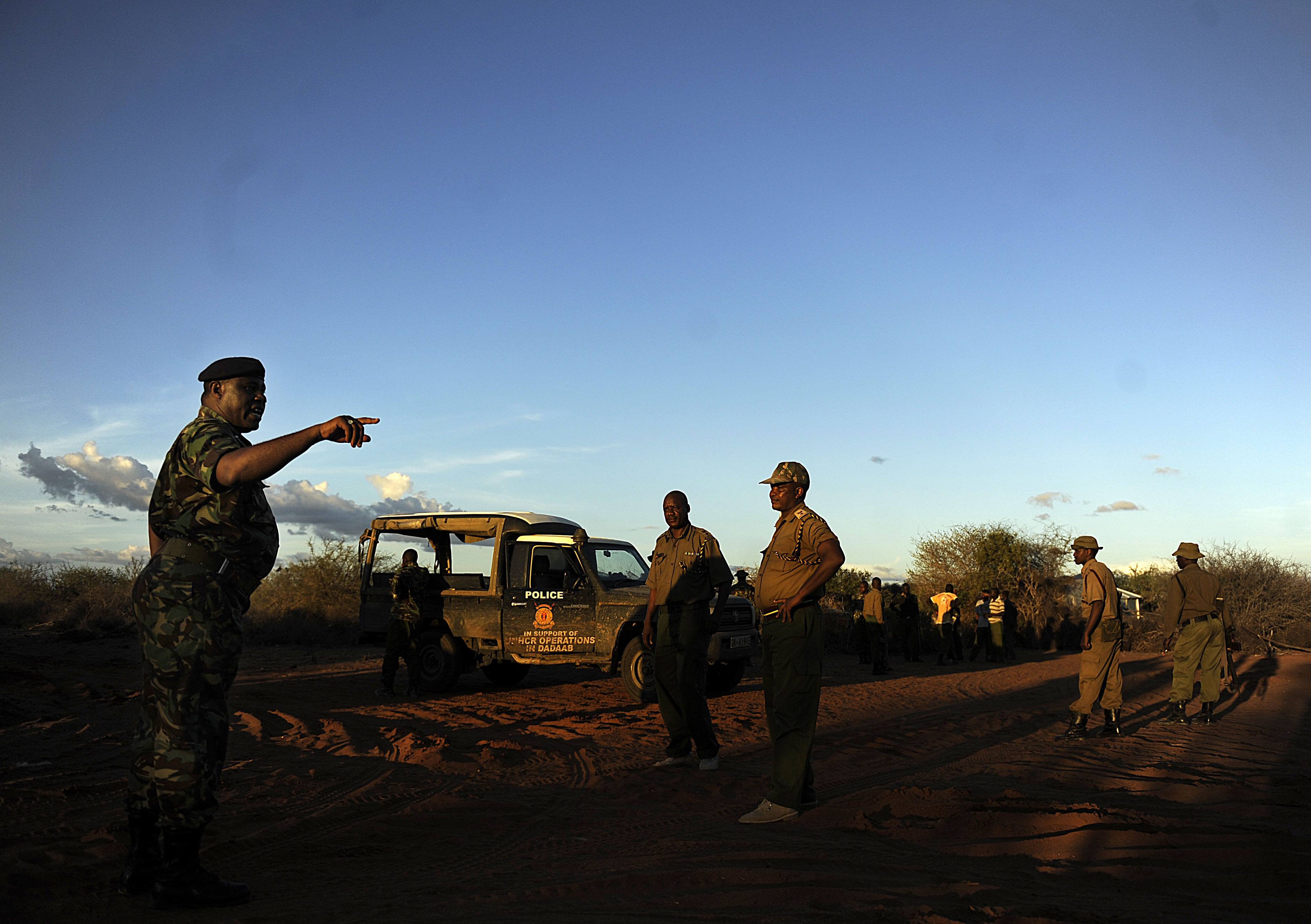 Kenyan security forces get instructions on October 15, 2011 during a search mission near Liboi, Kenya's border town with Somalia, where it is believed two Spanish aid workers kidnapped from Kenya's Dadaab refugee camp, in the company of five men of Somali appearance were last seen being marched towards the border. The Spaniards, both logistics officers with the aid group Medecins Sans Frontieres (MSF, Doctors Without Borders), are now believed to be in lawless Somalia. Kenyan forces will pursue gunmen accused of a spate of kidnappings of foreigners across the two nations' border, the internal security minister said on October 15. AFP PHOTO / TONY KARUMBA (Photo credit should read TONY KARUMBA/AFP/Getty Images)