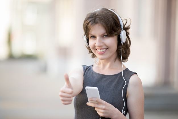 happy-girl-with-headphones-showing-a-positive-gesture_1163-858