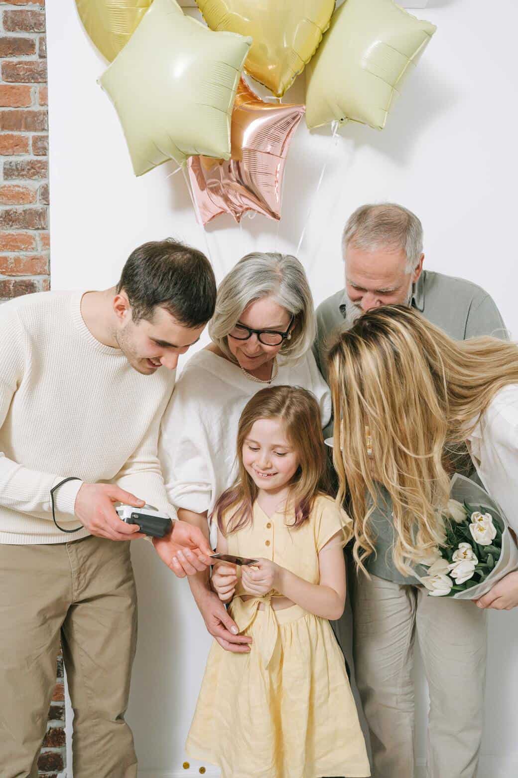 happy family looking at a picture together