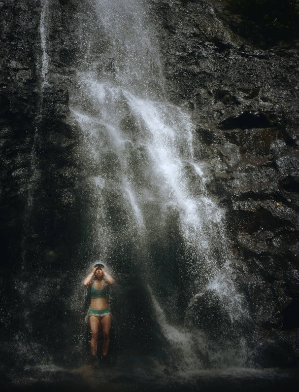 swim under a waterfall